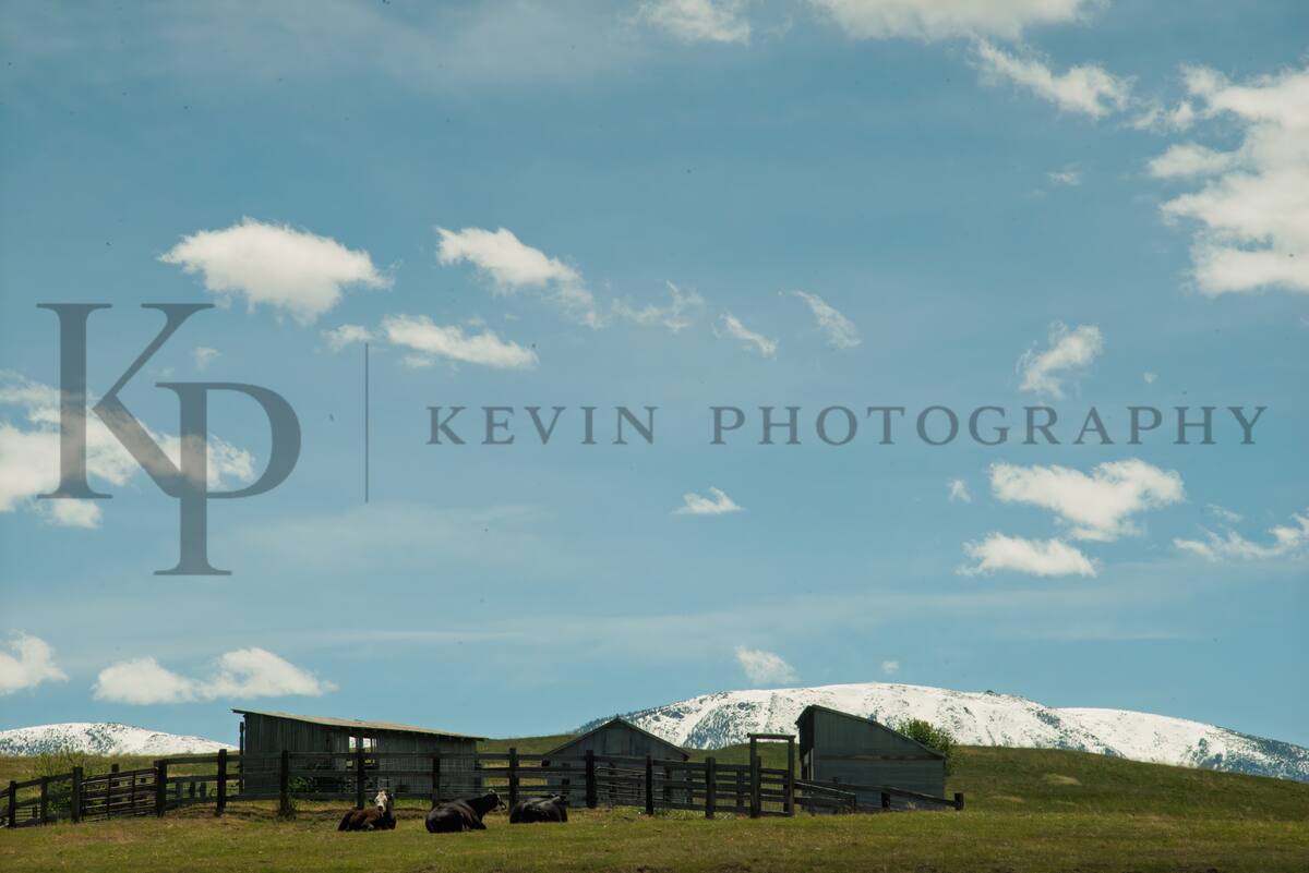 Ranch yard under snow-covered peaks